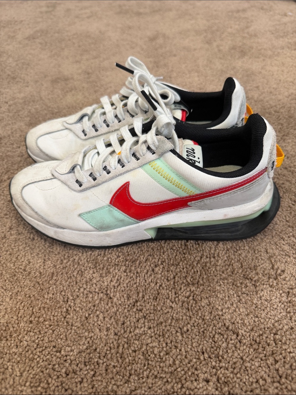 Nike White Sneakers with Red Swoosh and Mint Accents